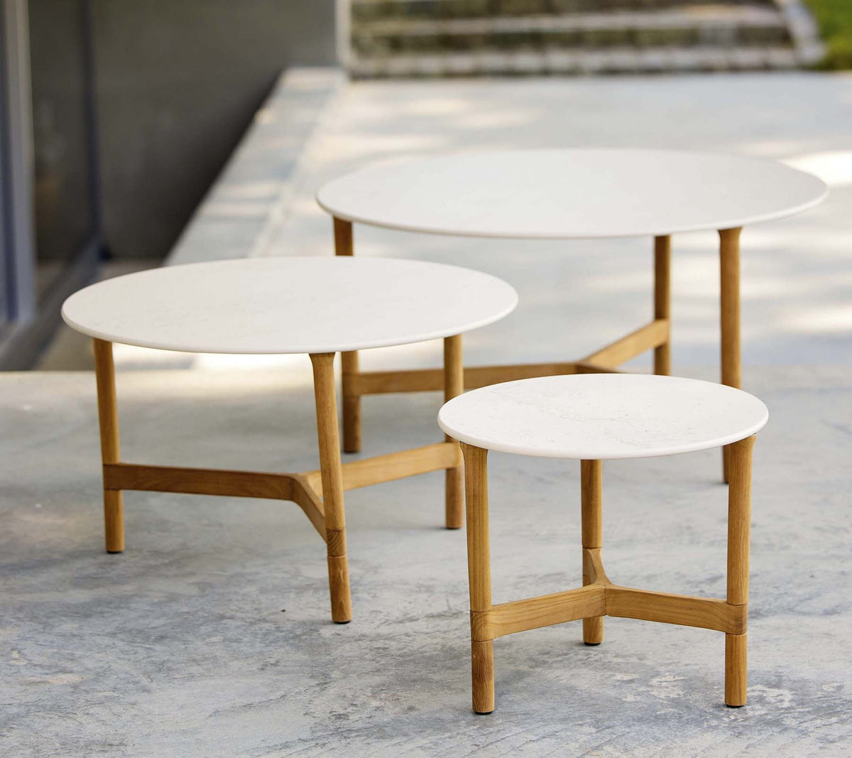 Cane-line Twist coffee tables arranged together
