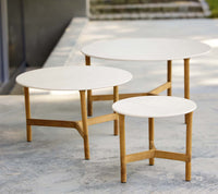 Cane-line Twist coffee tables arranged together