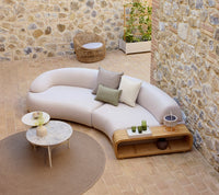 Cane-line Twist coffee table in a modern outdoor arrangement