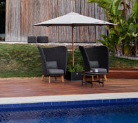 Cane-line Twist coffee tables in an outdoor seating area