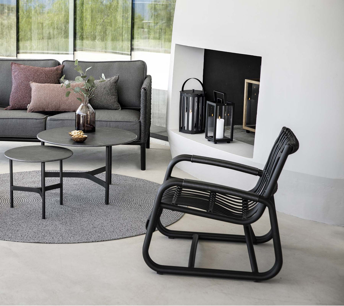 Cane-line Twist coffee tables in a complete outdoor lounge