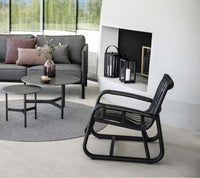 Cane-line Twist coffee tables in a complete outdoor lounge