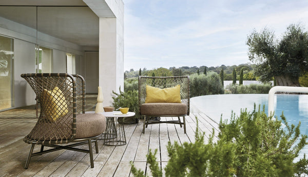 Roberti Charme Lounge Chair 4381B beside a pool in bronze finish