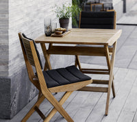 Flip folding chair by Cane-line
