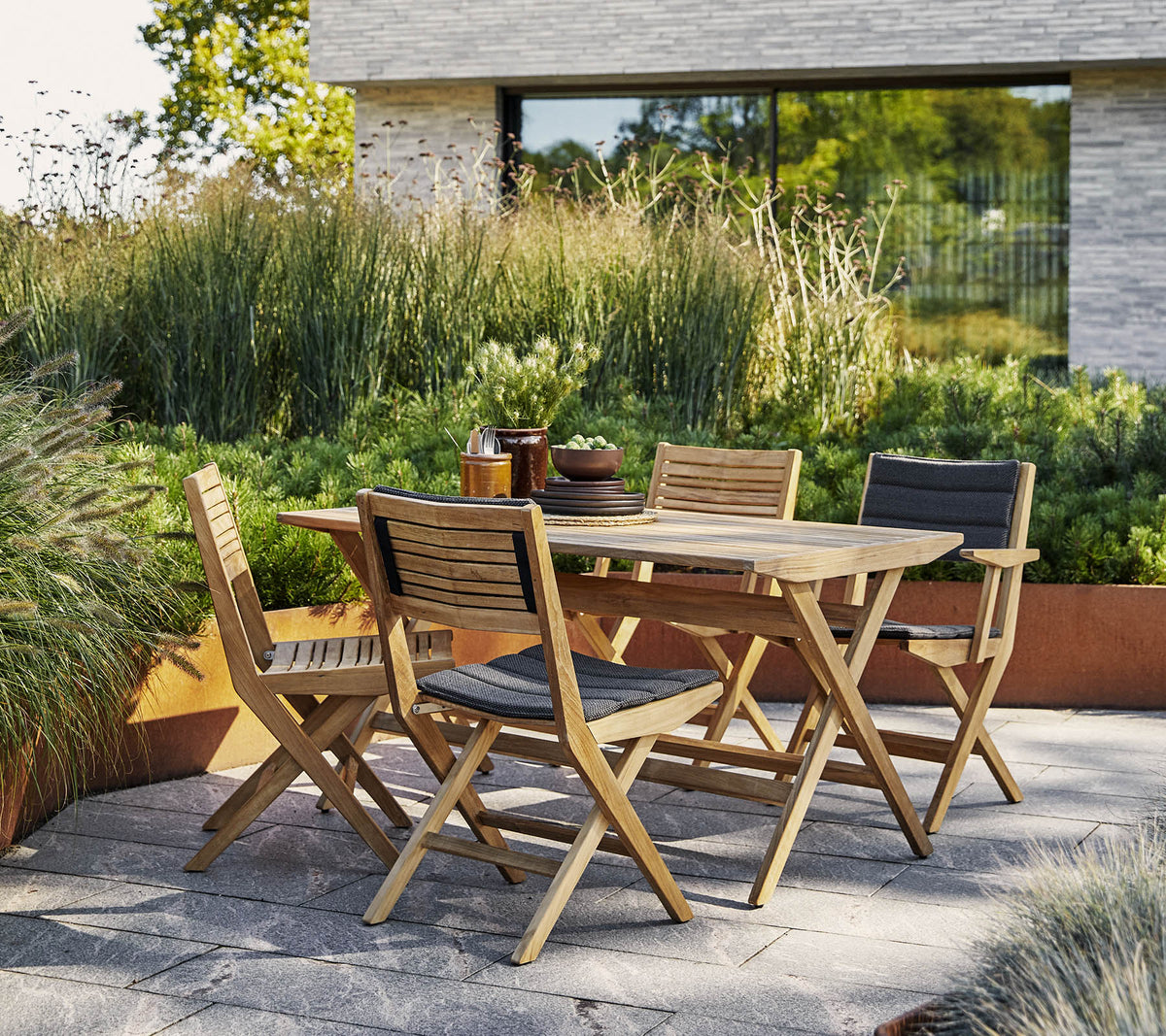 Flip folding chair by Cane-line