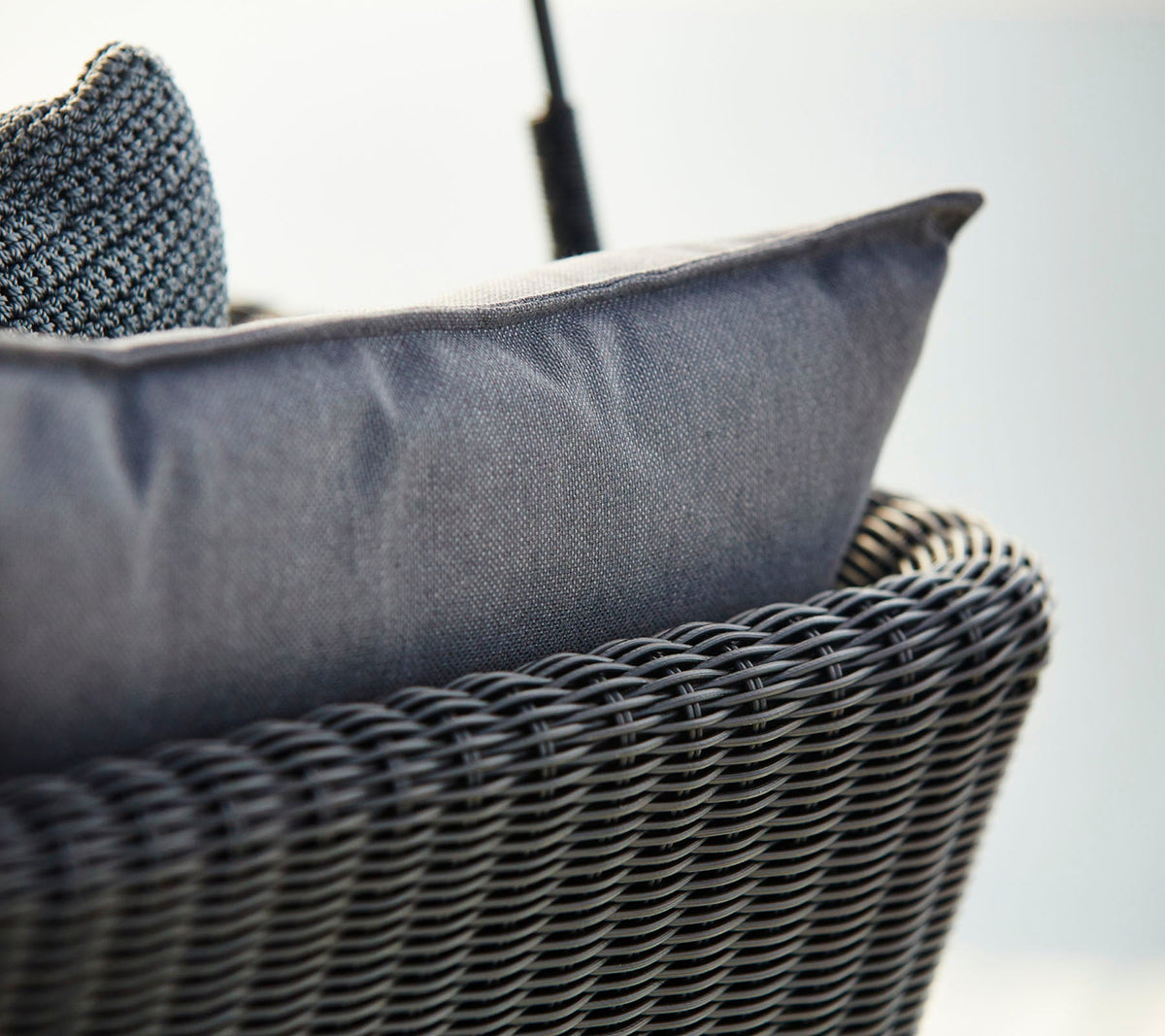 Cave Swing Sofa outdoor swing sofa by Cane-line, designed by Jesper K. Thomsen