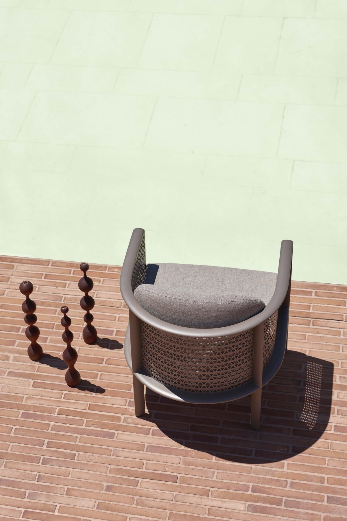 Gandia Blasco Arco Club Armchair in Bronze, rear outdoor view