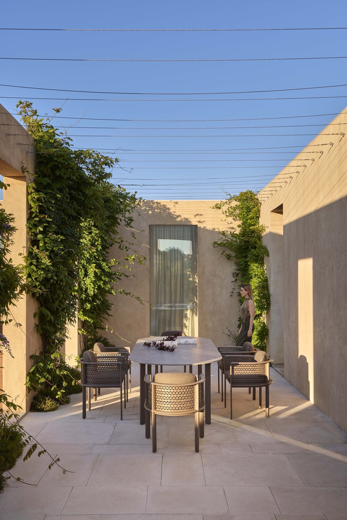 Gandia Blasco Arco Dining Armchairs in a modern outdoor dining setting