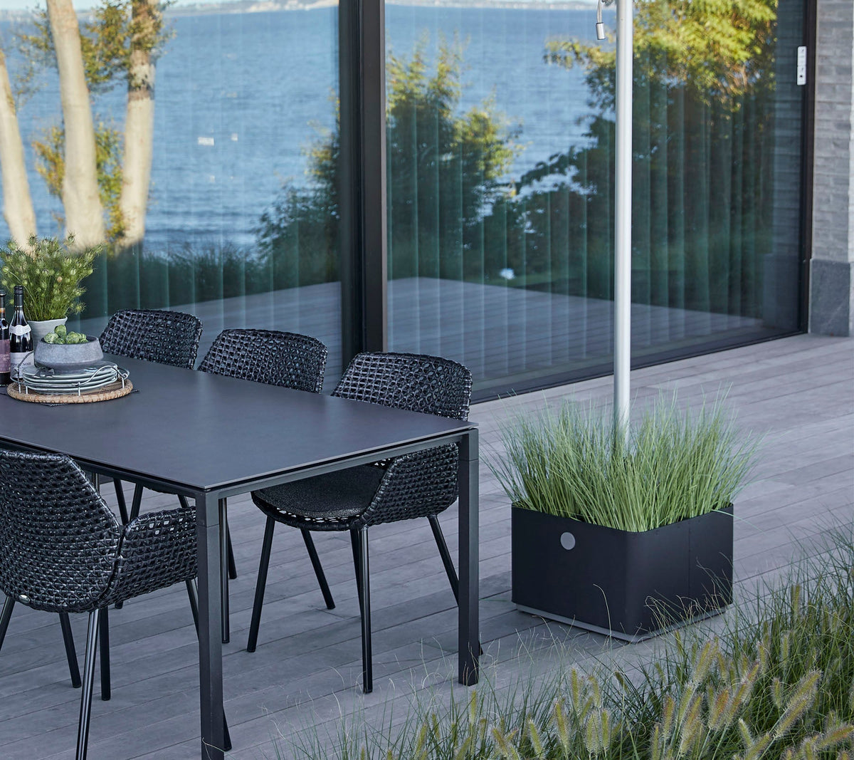 Grow parasol base with wheels by Cane-line, designed by Cane-line Design