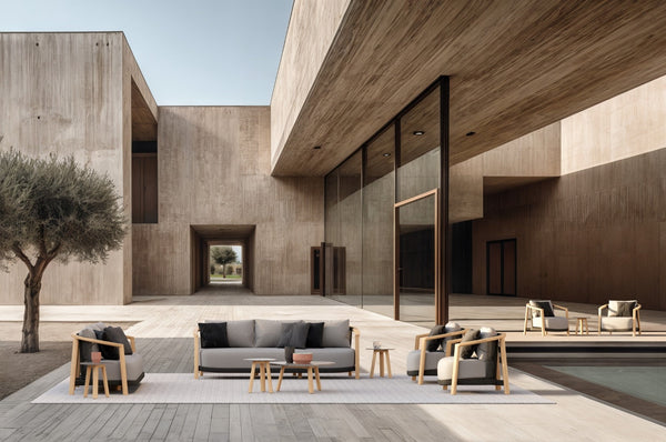 Lenis outdoor furniture collection by SKLD Studio in a modern architectural courtyard