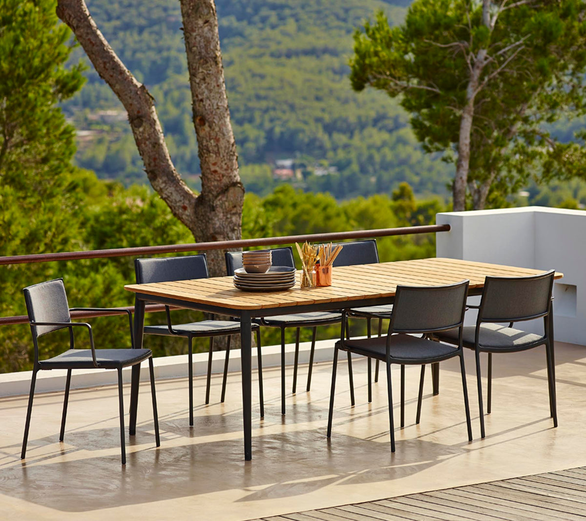 Less armchair outdoor dining set image by Cane-line