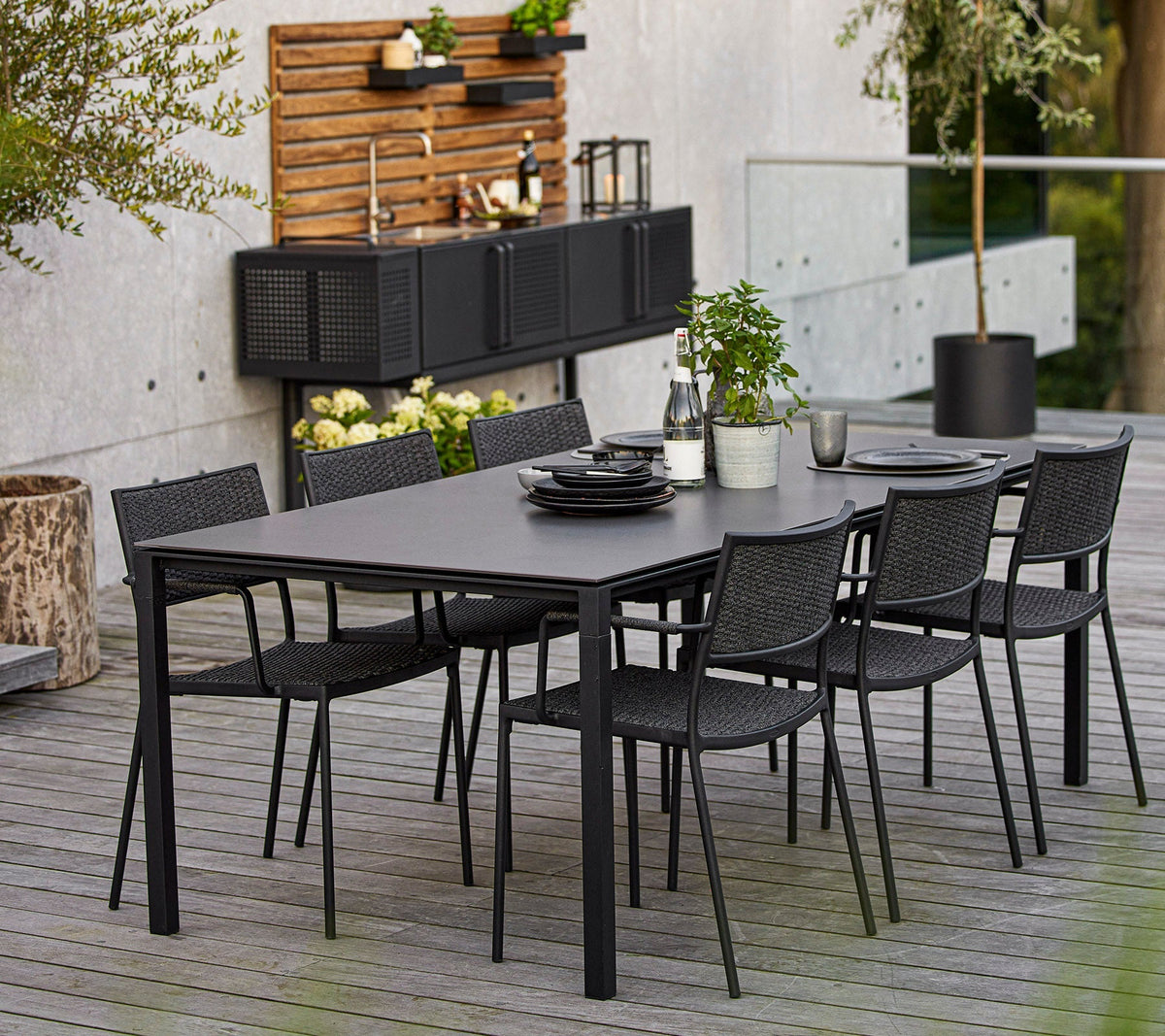 Less armchair outdoor dining lifestyle image by Cane-line