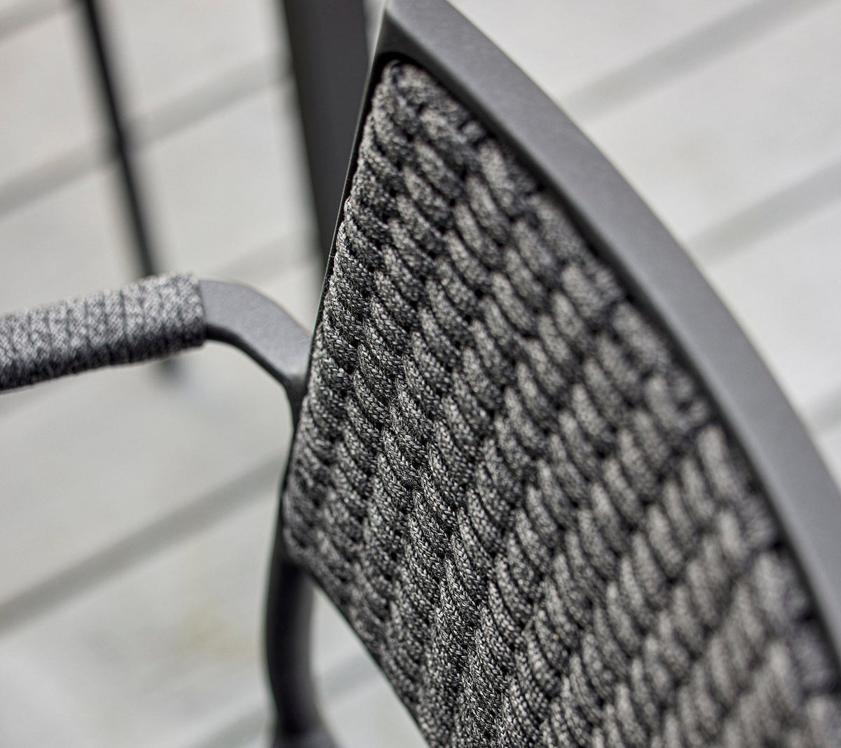 Less armchair outdoor dining lifestyle image by Cane-line