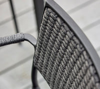 Less armchair outdoor dining lifestyle image by Cane-line