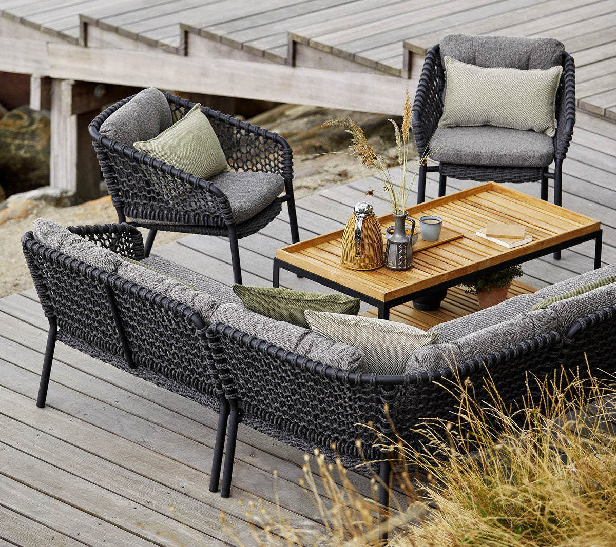 Level coffee table rectangular outdoor lounge lifestyle image by Cane-line