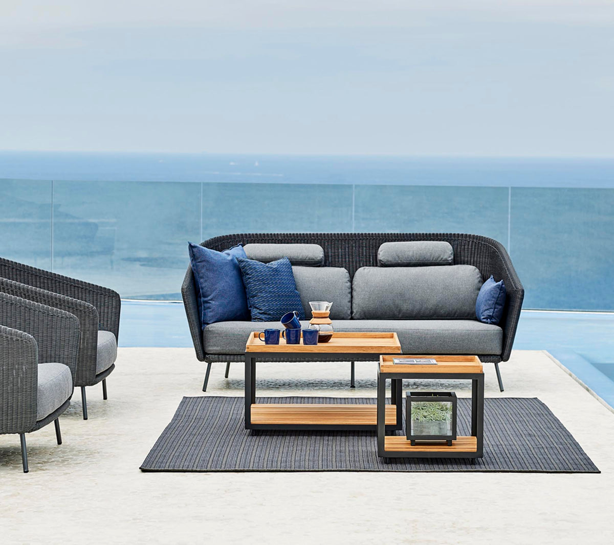 Level coffee tables outdoor lifestyle image by Cane-line