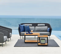 Level coffee tables outdoor lifestyle image by Cane-line