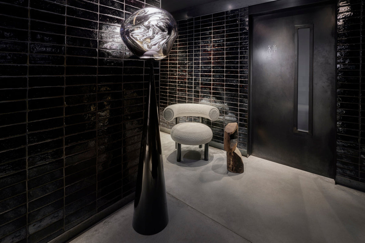 Melt Opal Slim Cone Floor Light Black floor light by Tom Dixon in a contemporary interior