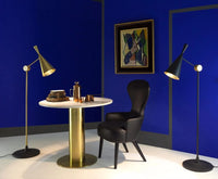 Beat Floor Light Matt Black Brass floor light by Tom Dixon in a contemporary interior