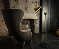 Beat Floor Light Polished Brass floor light by Tom Dixon in a modern room setting