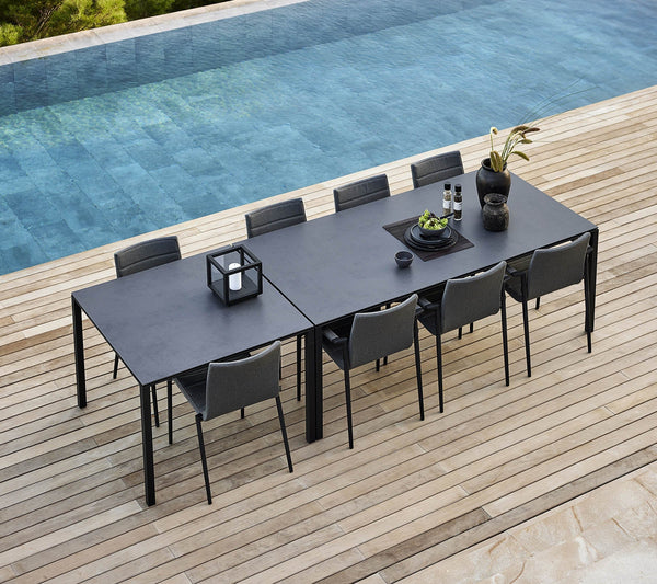 Pure dining table 100x100 cm lifestyle image with Core chair by Cane-line