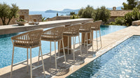 Roberti Altomare outdoor bar seating beside a pool