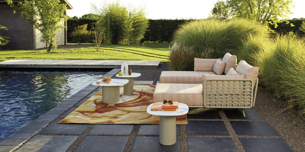 Roberti Armàn chaise seating beside a pool