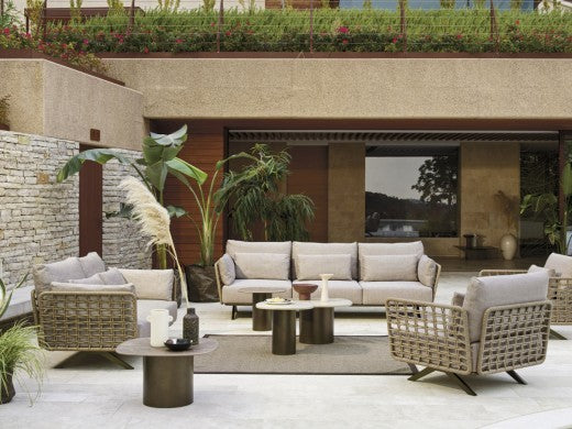 Roberti Armàn lounge chairs with sofa and coffee tables outdoors