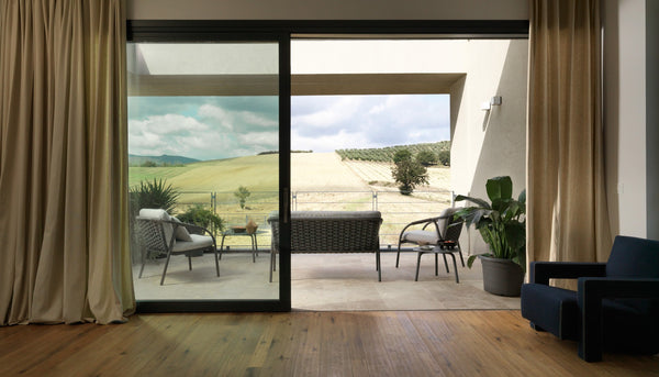Roberti Capri 4311 lounge chairs and 4312 sofa in Graphite on a terrace