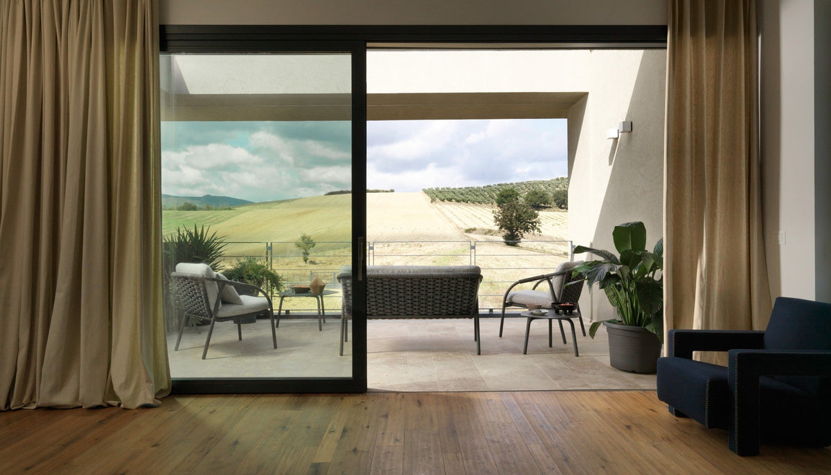 Roberti Capri 4312 sofa with 4311 lounge chairs in Graphite on a terrace