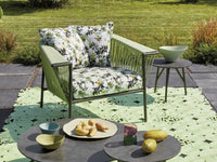 Roberti Corolle coffee table with lounge seating in a garden