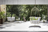 Roberti Gravity 9881 hanging sofa and 9882 round sofa in an outdoor setting