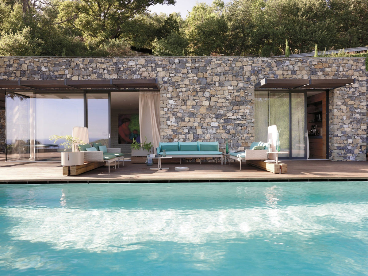 Roberti Key West two seater sofa within a poolside lounge composition