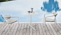 Roberti Maratea armchairs and bistrot table beside a pool