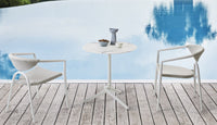 Roberti Maratea bistrot table and armchairs beside a pool
