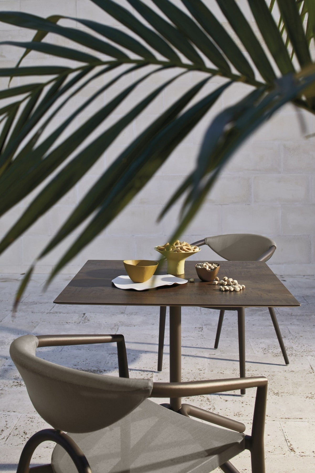 Roberti Maratea 9916 table and 9911 armchair detail in Terra and Corten