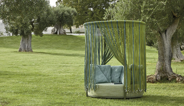 Roberti Oasi Day Bed 4391 in Forest and Grass Turquoise in a garden