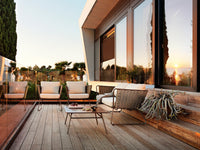 Roberti Portofino lounge seating and coffee table at sunset