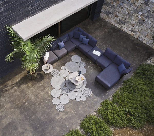 Roberti Queen modular seating and pouf lifestyle setting