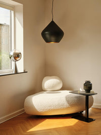 Tom Dixon Beat Fat Pendant in Matt Black Brass in a modern interior