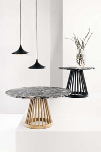 Tom Dixon Beat Wide Pendants in Matt Black Brass above dining tables