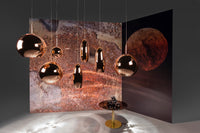 Tom Dixon Copper pendant family in a warm interior installation