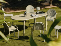 Tom Dixon Groove Large Obround Outdoor Table in an outdoor dining setting