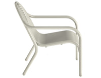 Tom Dixon Groove Outdoor Lounge Chair in a garden lifestyle setting