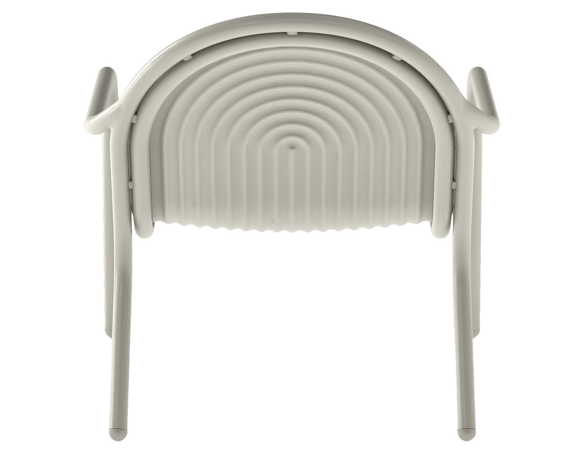 Tom Dixon Groove Outdoor Lounge Chair in a garden lifestyle setting