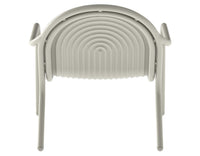 Tom Dixon Groove Outdoor Lounge Chair in a garden lifestyle setting
