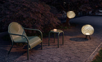 Tom Dixon Groove Outdoor Lounge Chair in a garden lifestyle setting
