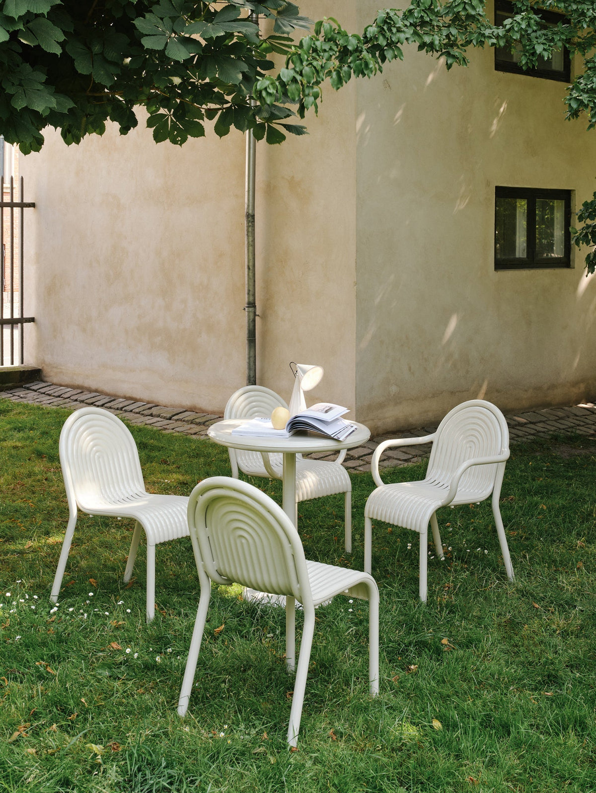 Tom Dixon Groove Outdoor Side Chair in an outdoor dining setting