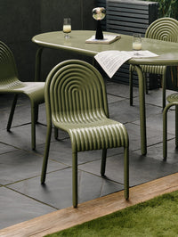 Tom Dixon Groove Outdoor Small Round Table in an outdoor dining setting
