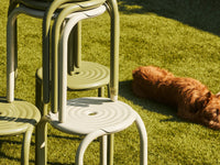 Tom Dixon Groove Outdoor Stool in an outdoor lifestyle setting